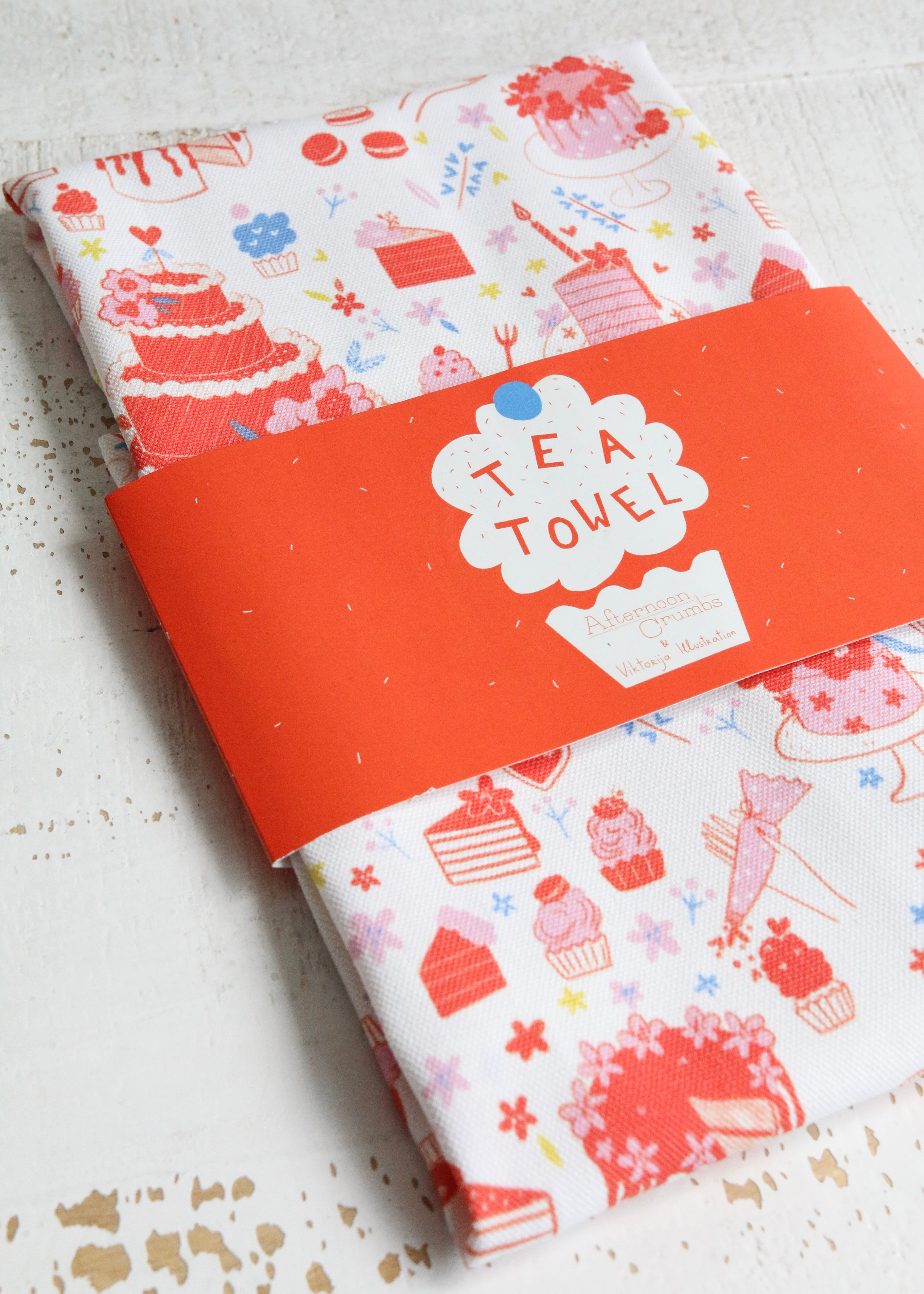 Illustrated Tea Towel Featuring Cake & Cupcakes Angle