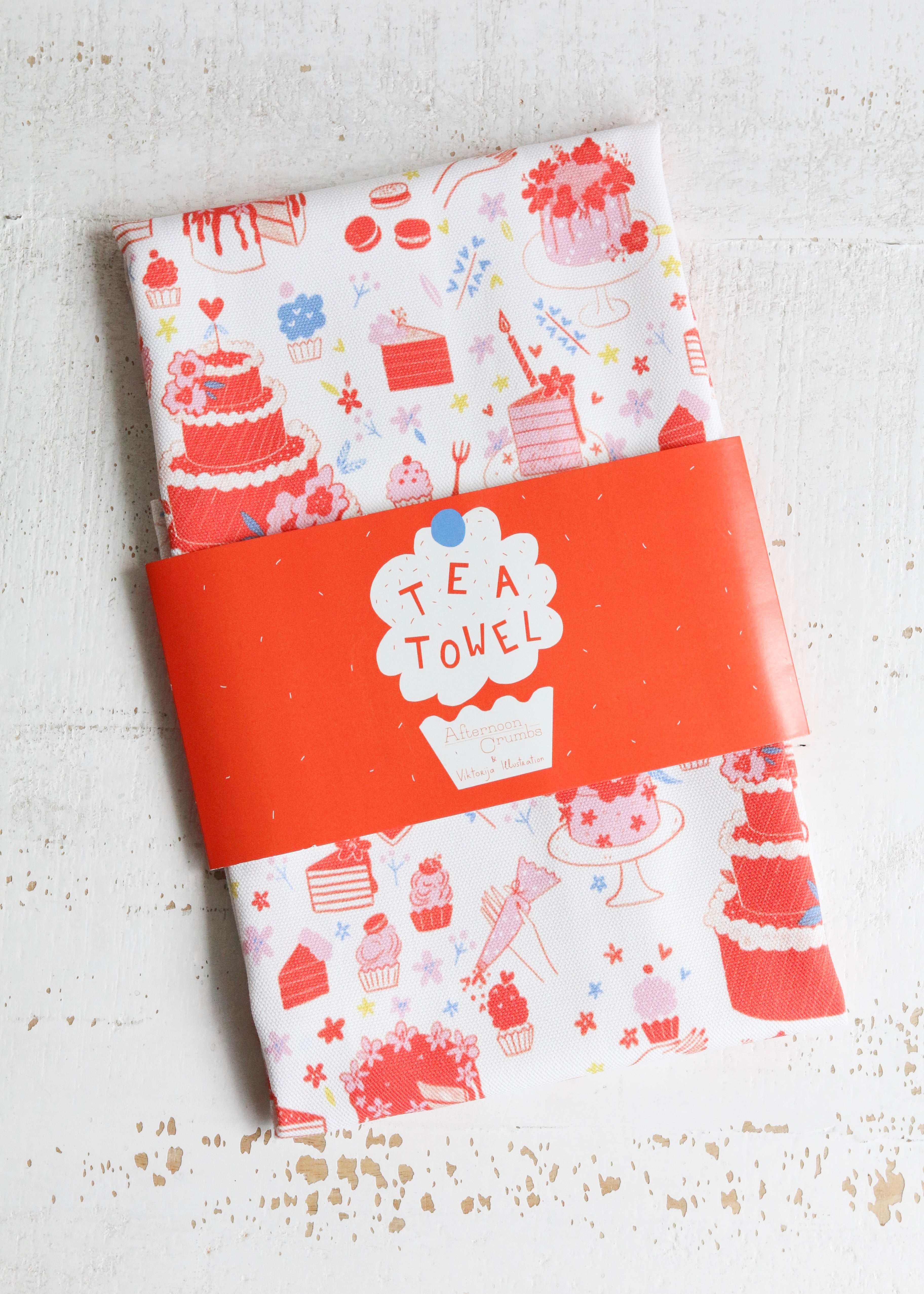 Illustrated Tea Towel Featuring Cake & Cupcakes Flat Lay