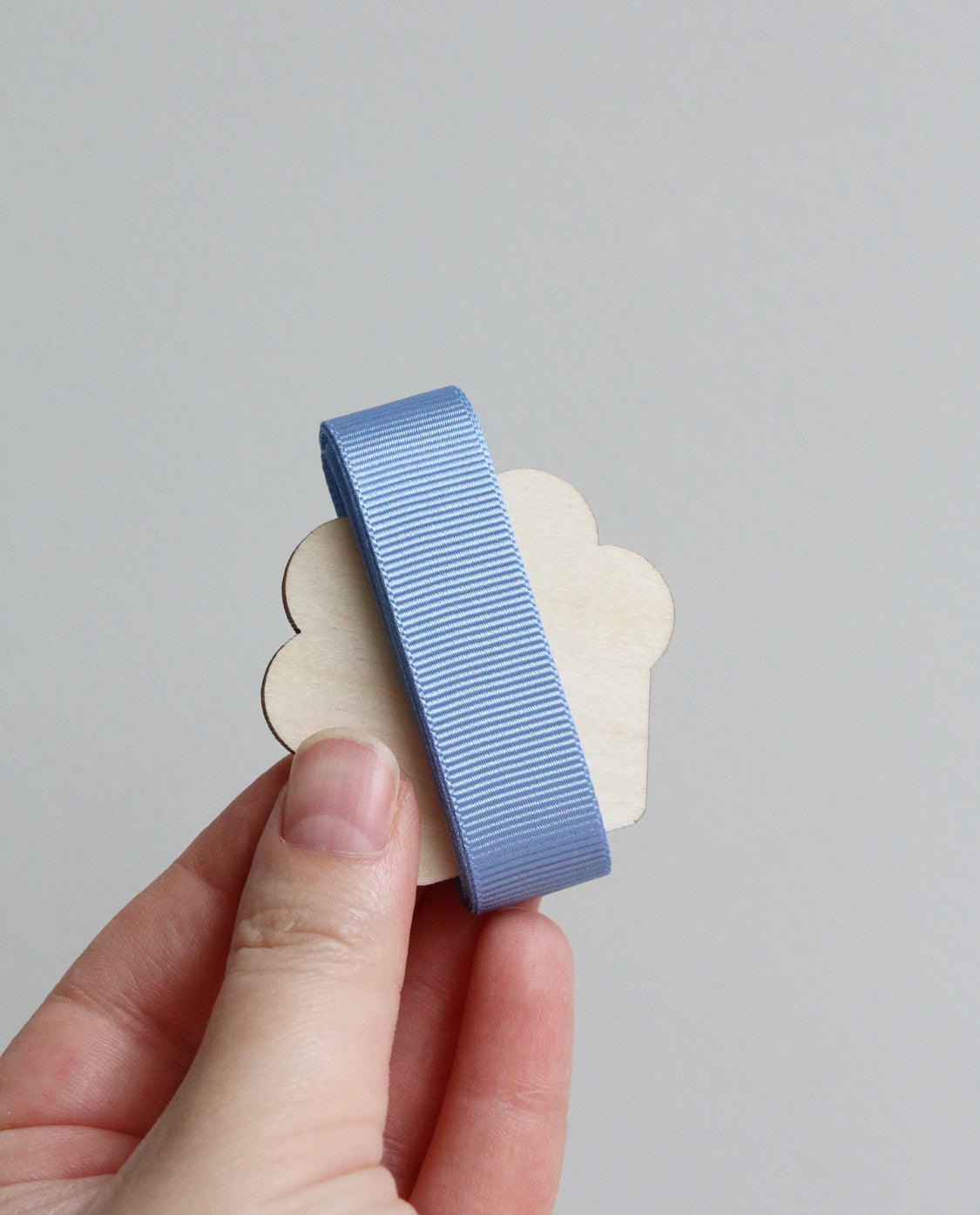 Light blue grosgrain ribbon on wooden cutout cupcake