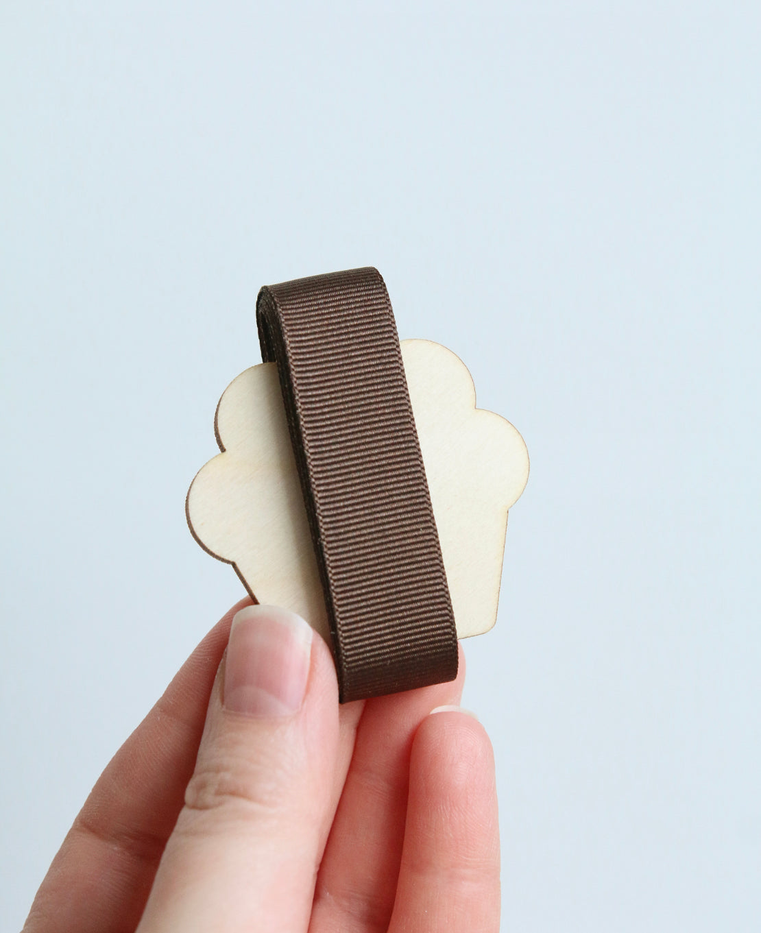 Brown Ribbon on Wooden Cupcake
