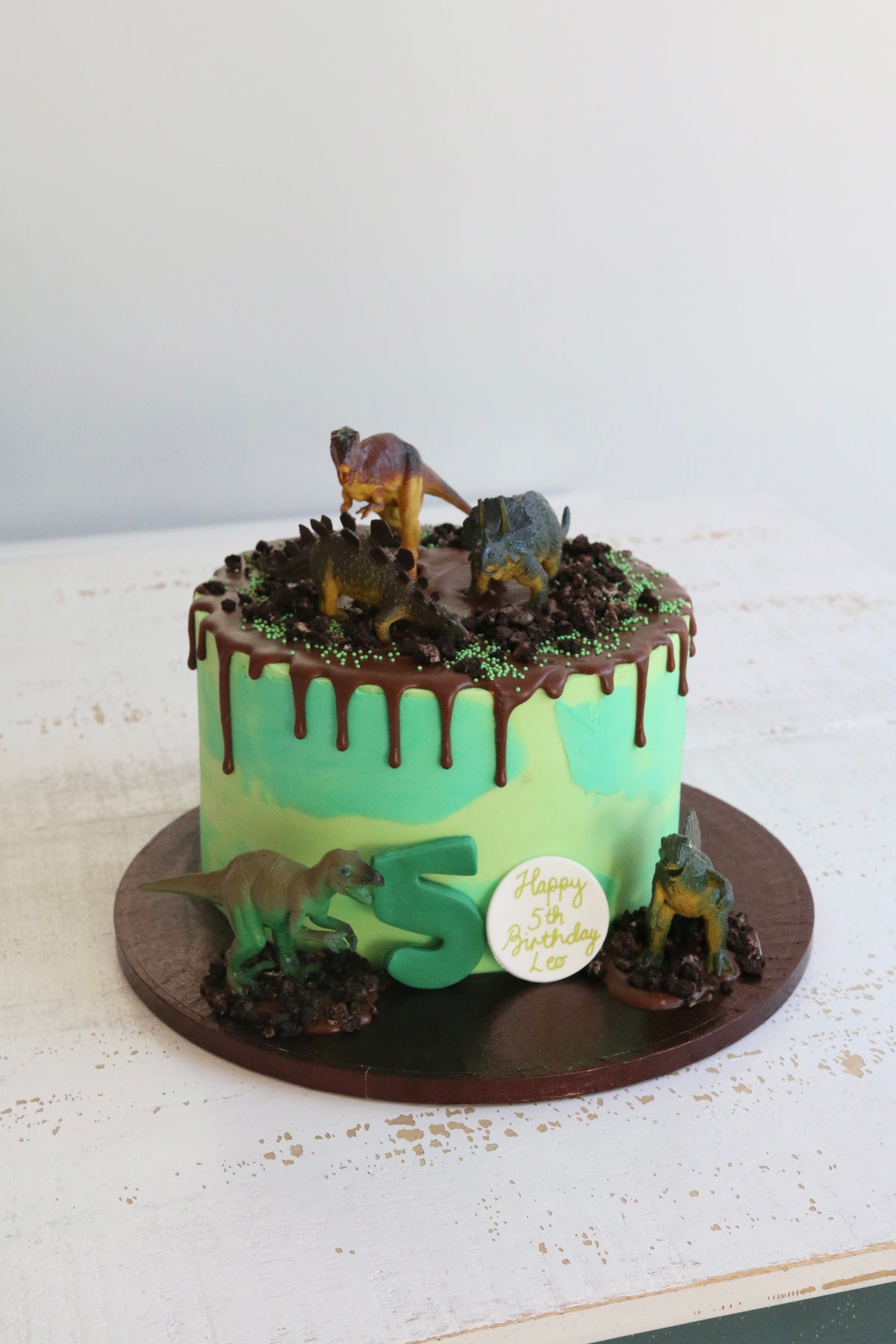 Green Dinosaur 5th Birthday Drip Cake with Toy Dinosaur Figures