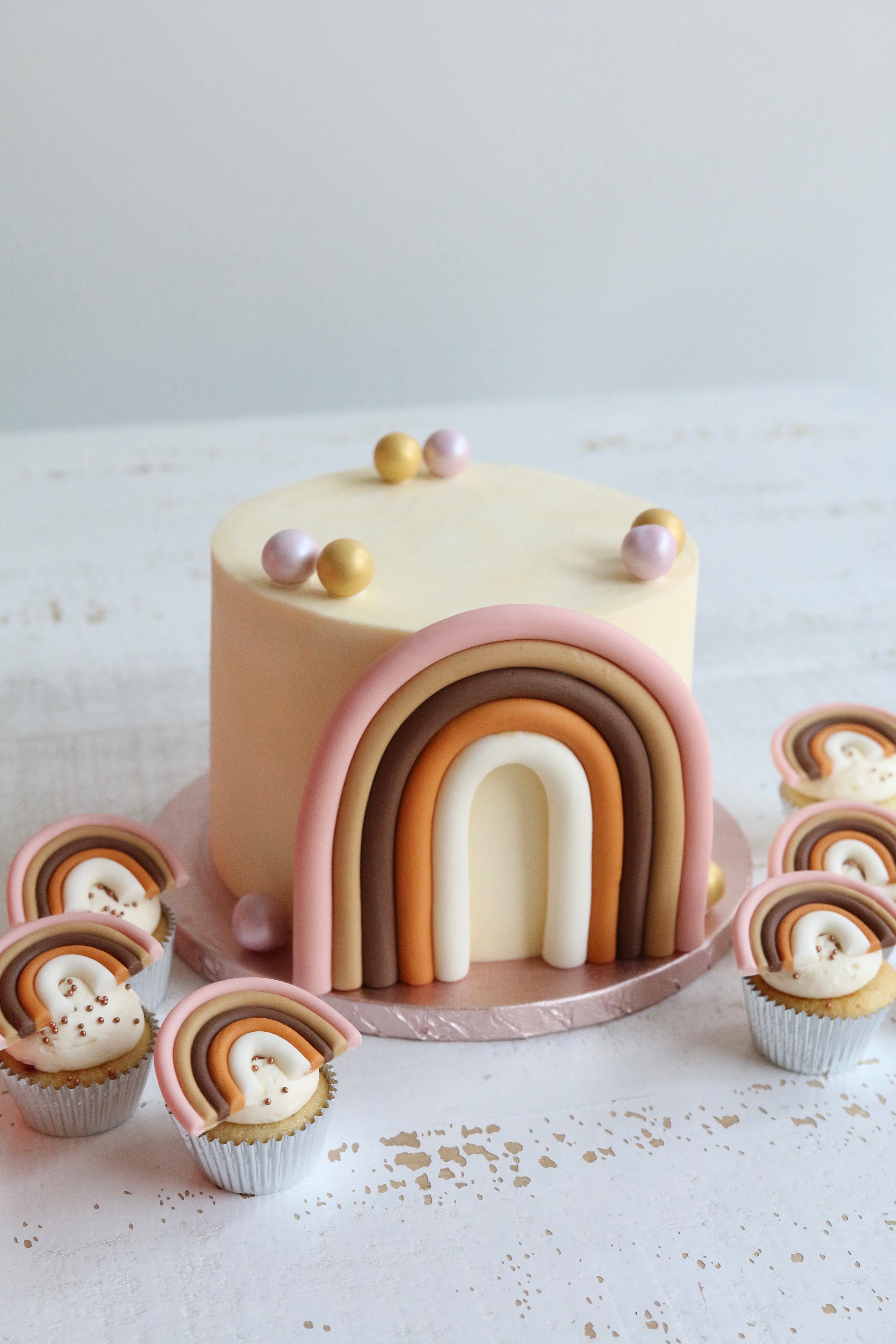 Muted Rainbow 1st Birthday Cake and Cupcakes