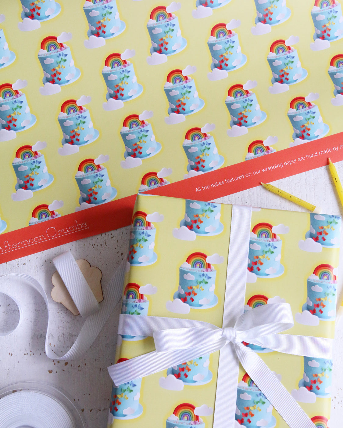 Rainbow Cake Wrapping Paper With logo tied with Ribbon