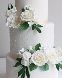 White Wedding Cake with White Flowers Close Up
