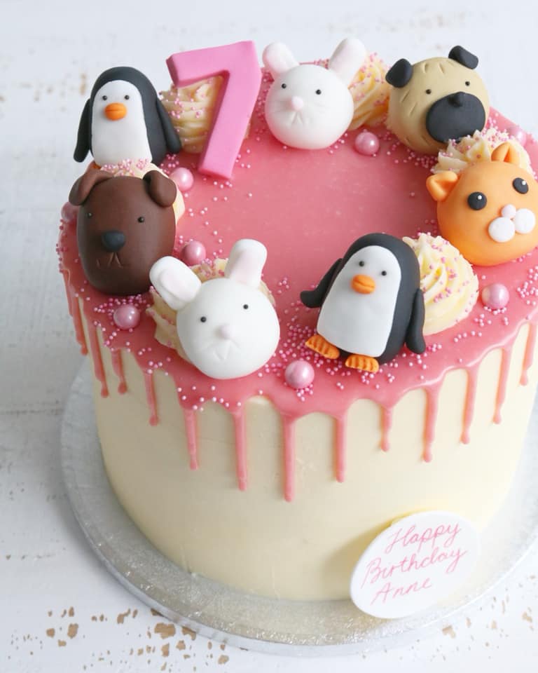 Pink Drip Cake with Animal Decorations - Penguins, Dogs, Cats and Bunnies