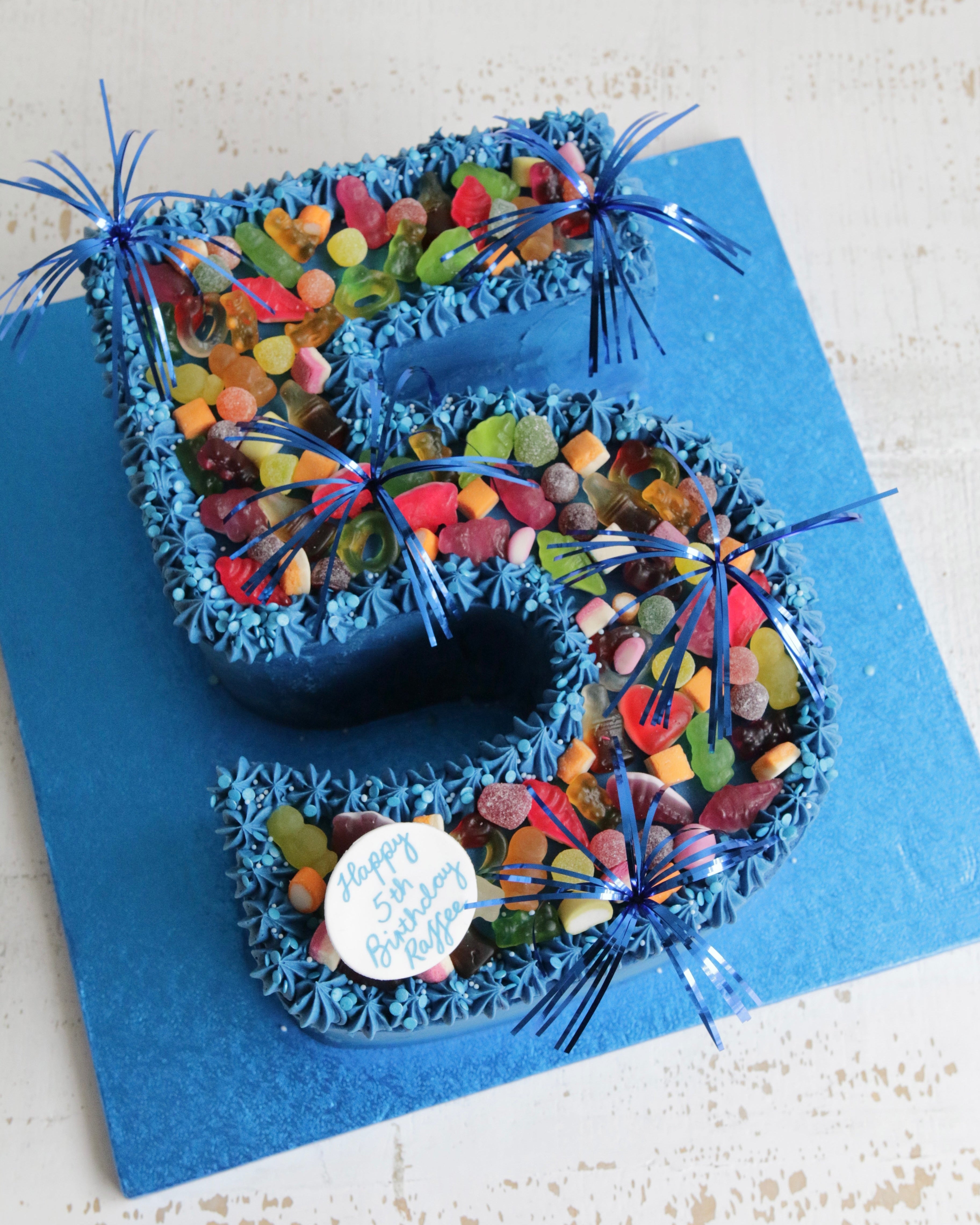 Blue Buttercream Number 5 Cake with Sweets and Sprinkler Decorations