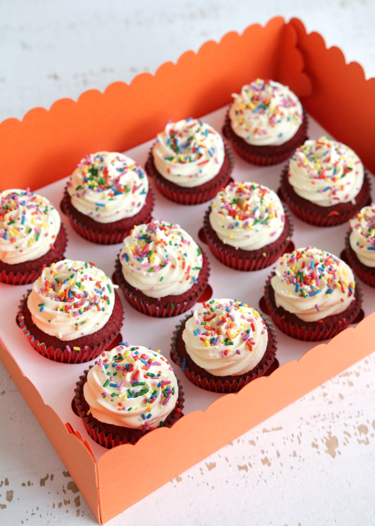 Box of 12 Red Velvet Cupcakes with Rainbow Sprinkles