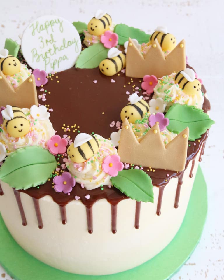 Chocolate Drip Cake with Bee and Crown Decorations