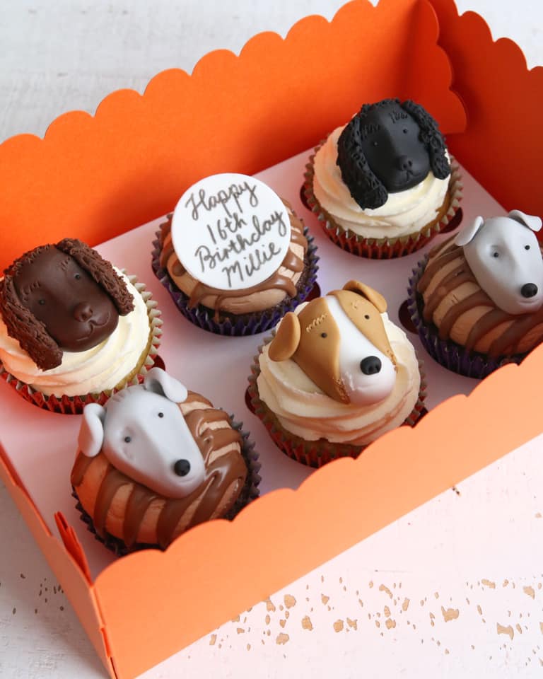 Cupcakes with fondant faces of different dog breeds