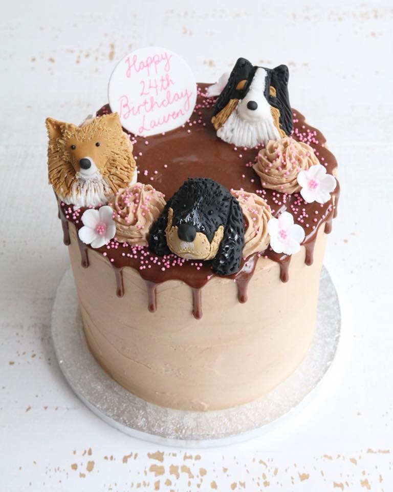 Birthday drip cake with dog decorations
