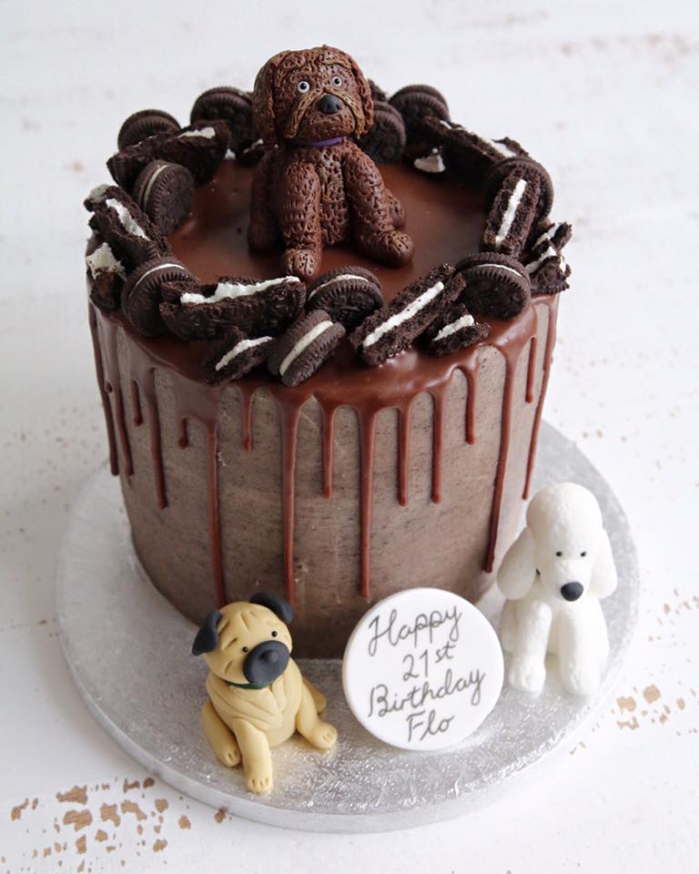 Oreo drip cake with dog figures