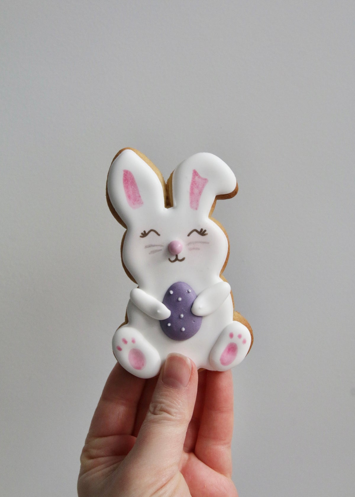 Easter Bunny Biscuit Holding Purple Egg