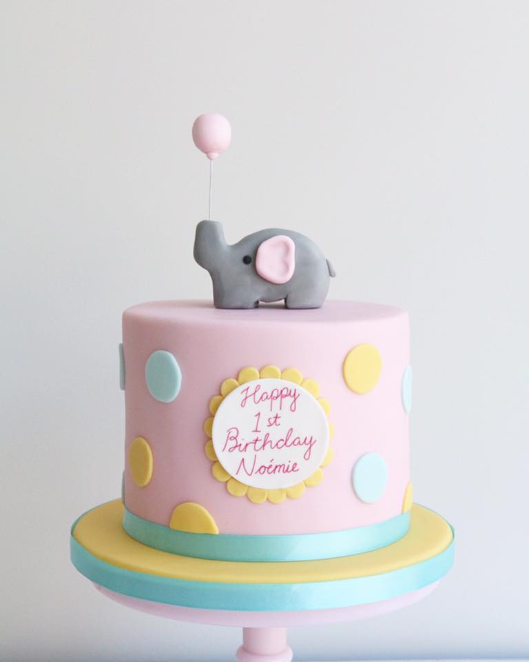 Pink 1st Birthday Cake with Elephant Holding a Pink Balloon