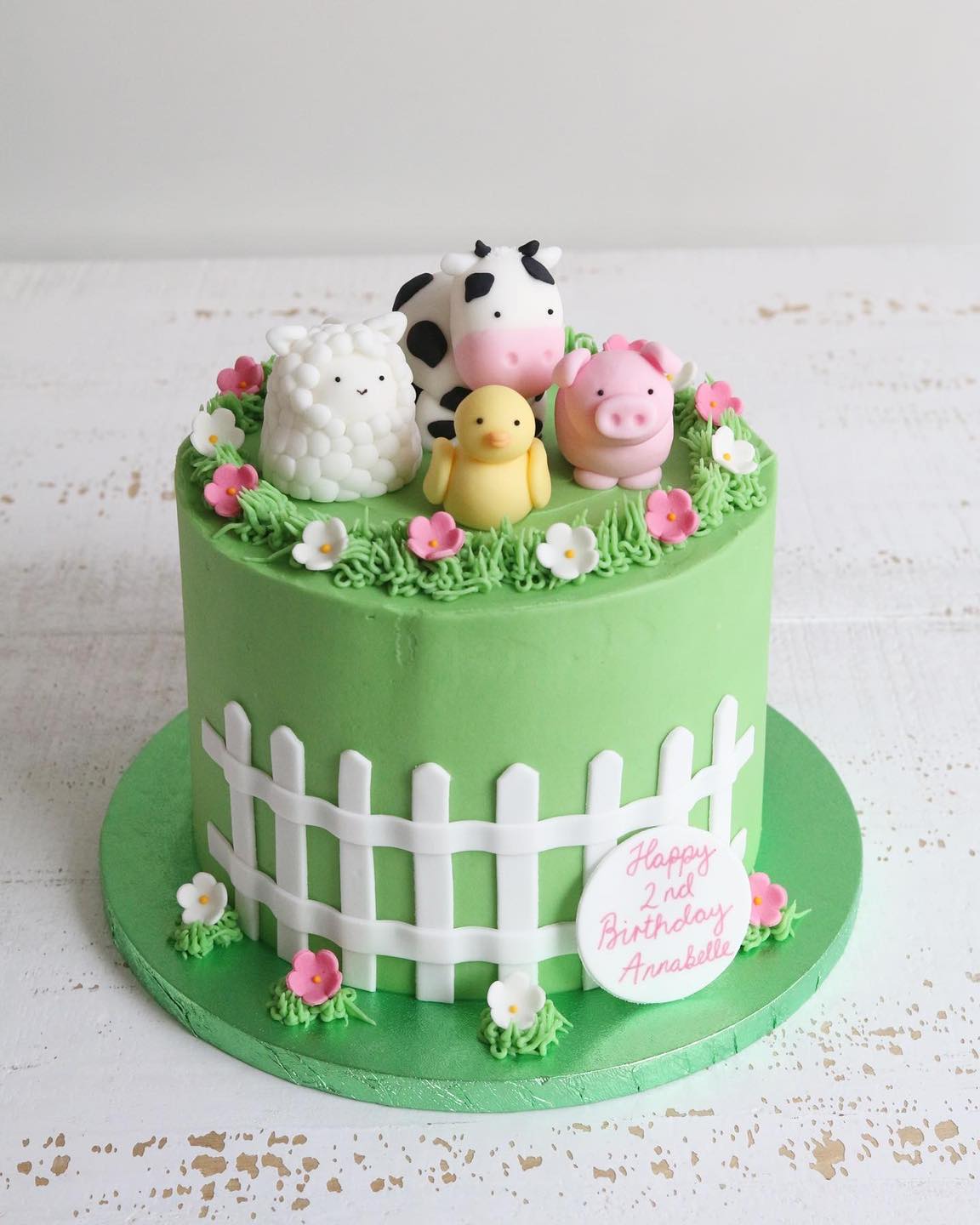 Green Buttercream Cake with White Fence and Fondant Farm Animal Decorations - Cow, Pig, Sheep and Duck