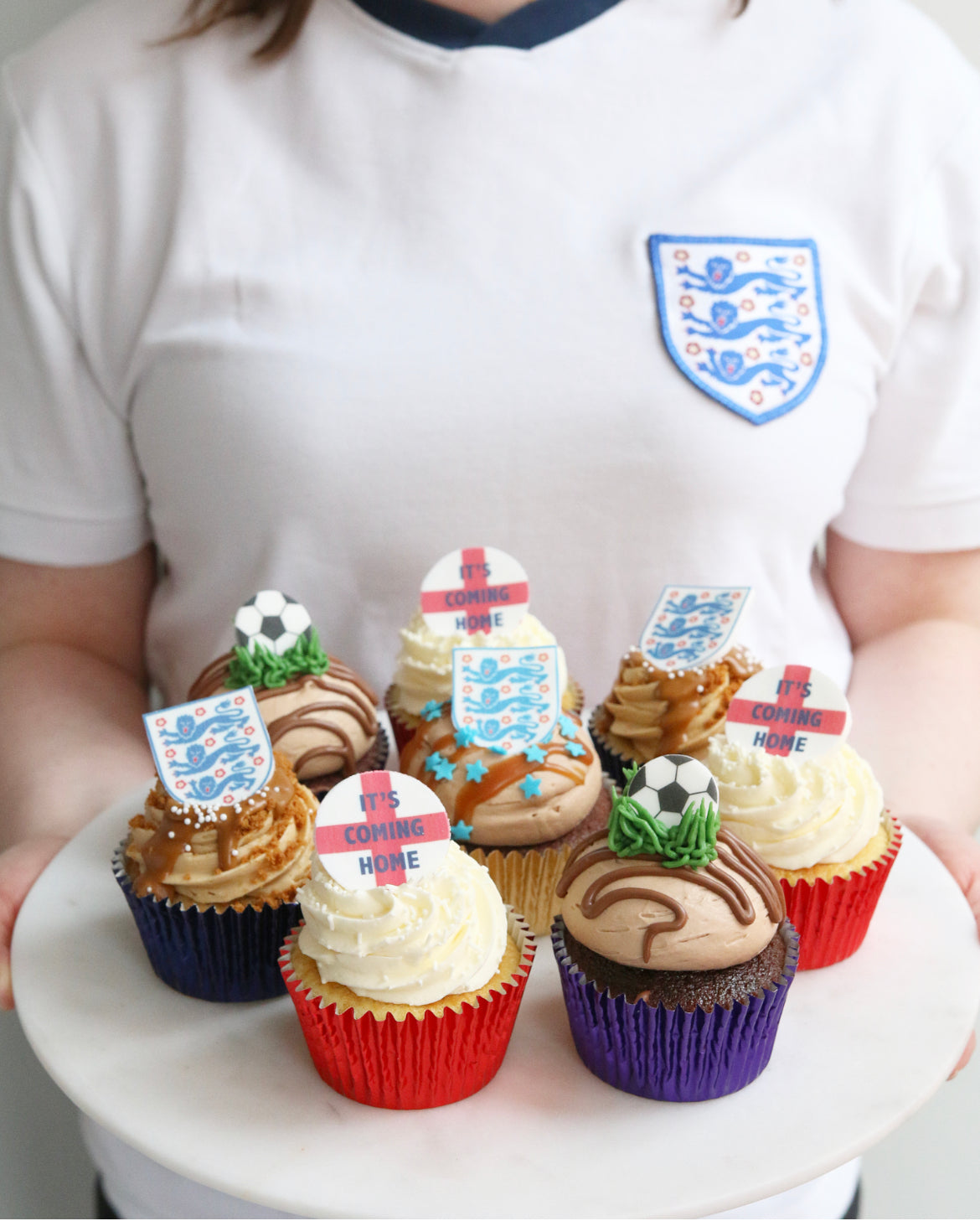 Holding Tray of England Football Cupcakes wearing England Shirt
