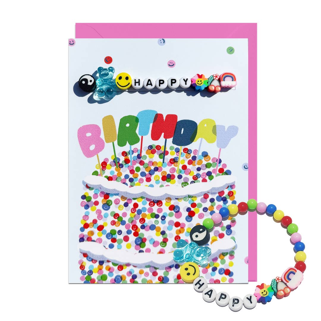 Birthday card with colourful birthday cake decorations and a bracelet that reads 'Happy'