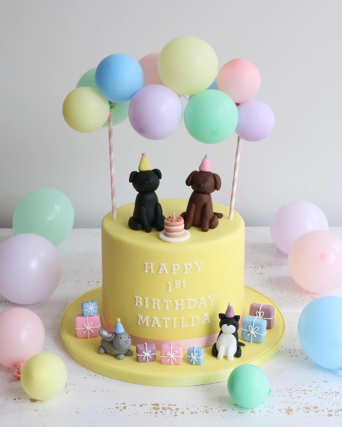 Yellow Fondant 1st Birthday Cake with Balloons, Dogs in Party Hats, Cake, Bunny, Cat and Presents