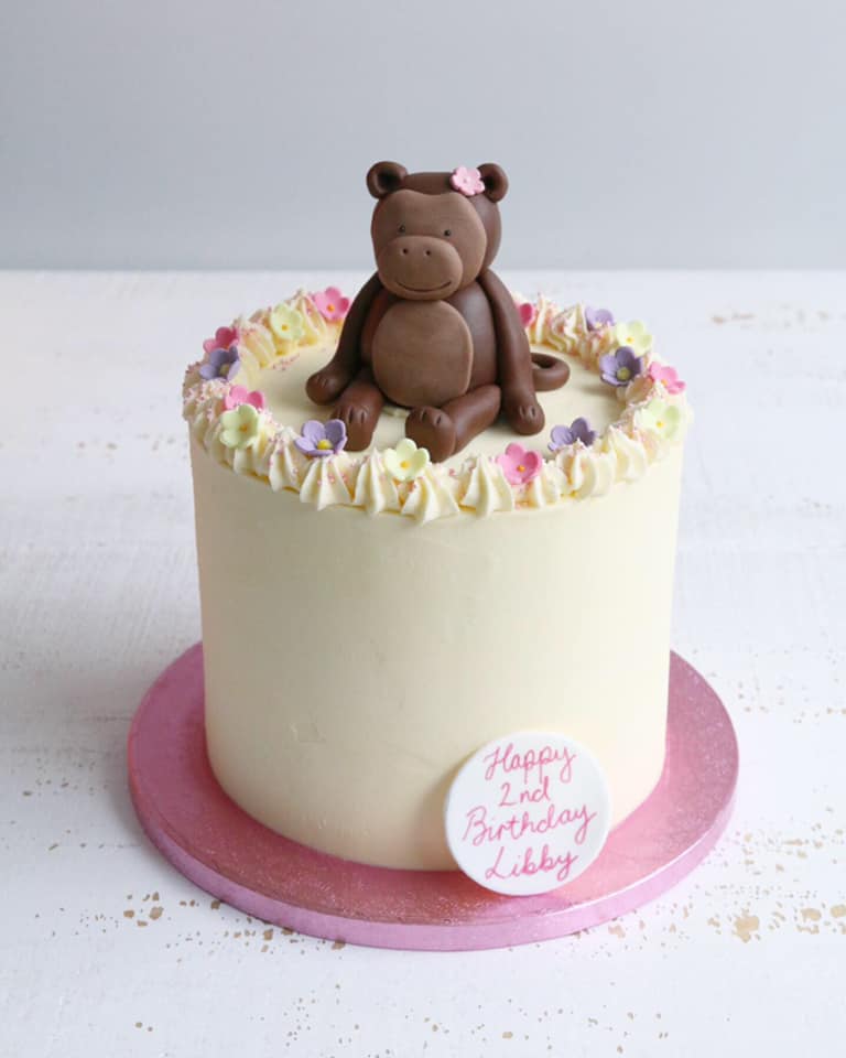Buttercream Cake with Monkey Figure and Flowers
