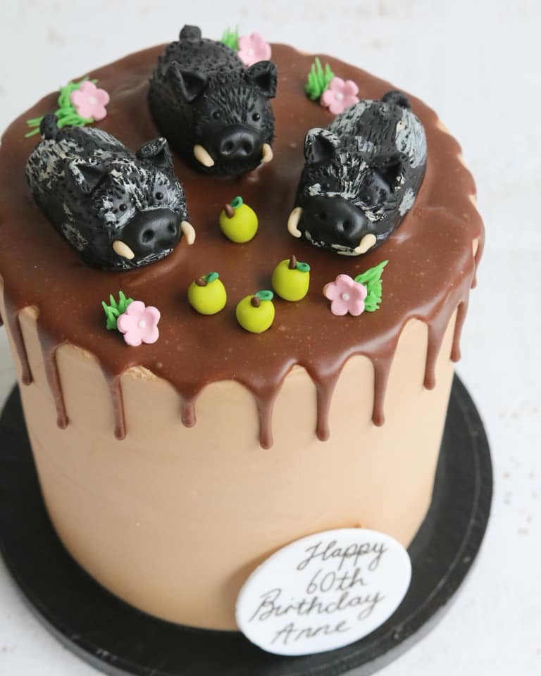 Chocolate Drip Cake with Black Pig Decorations