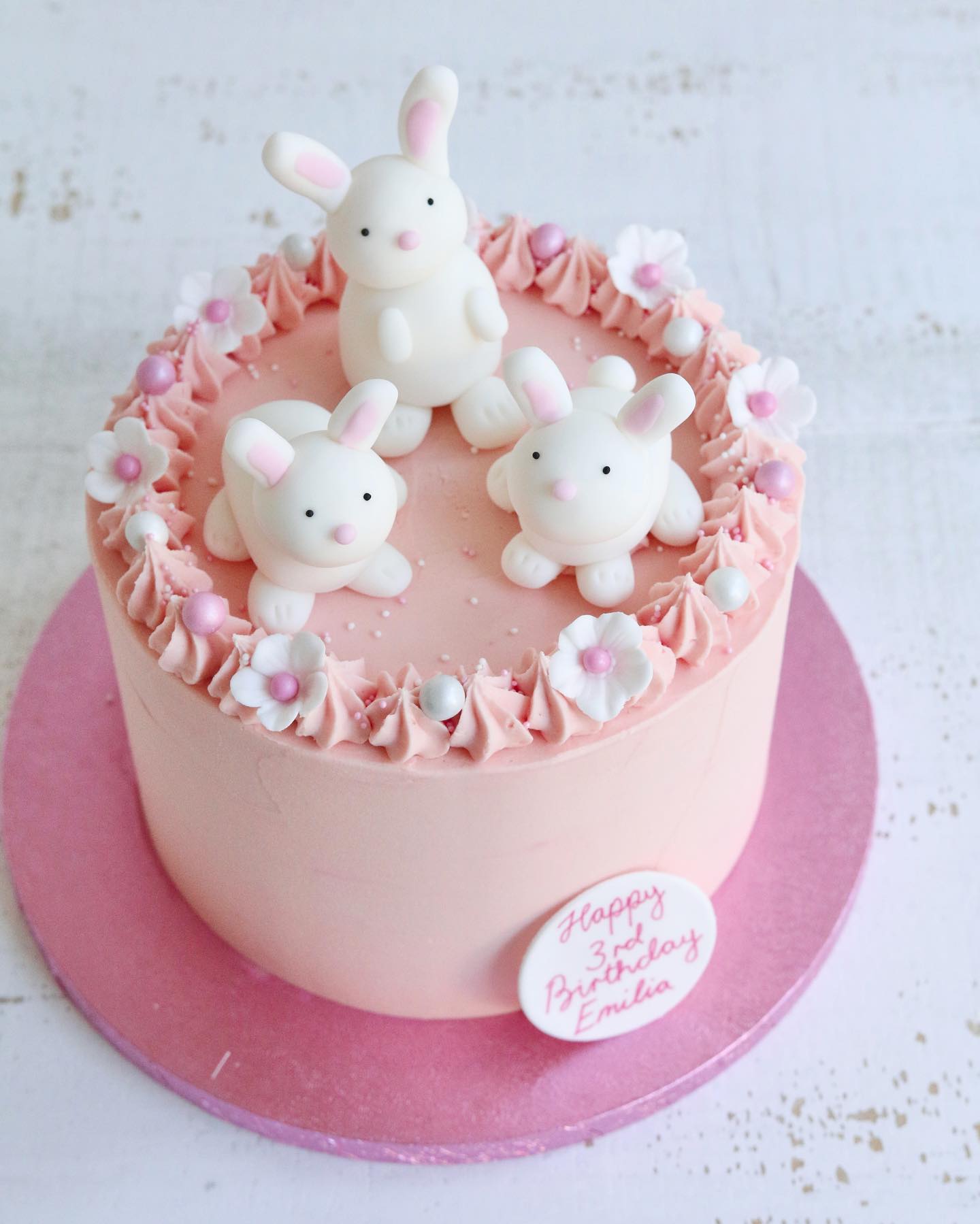 Pink Birthday Cake with Bunny Decorations