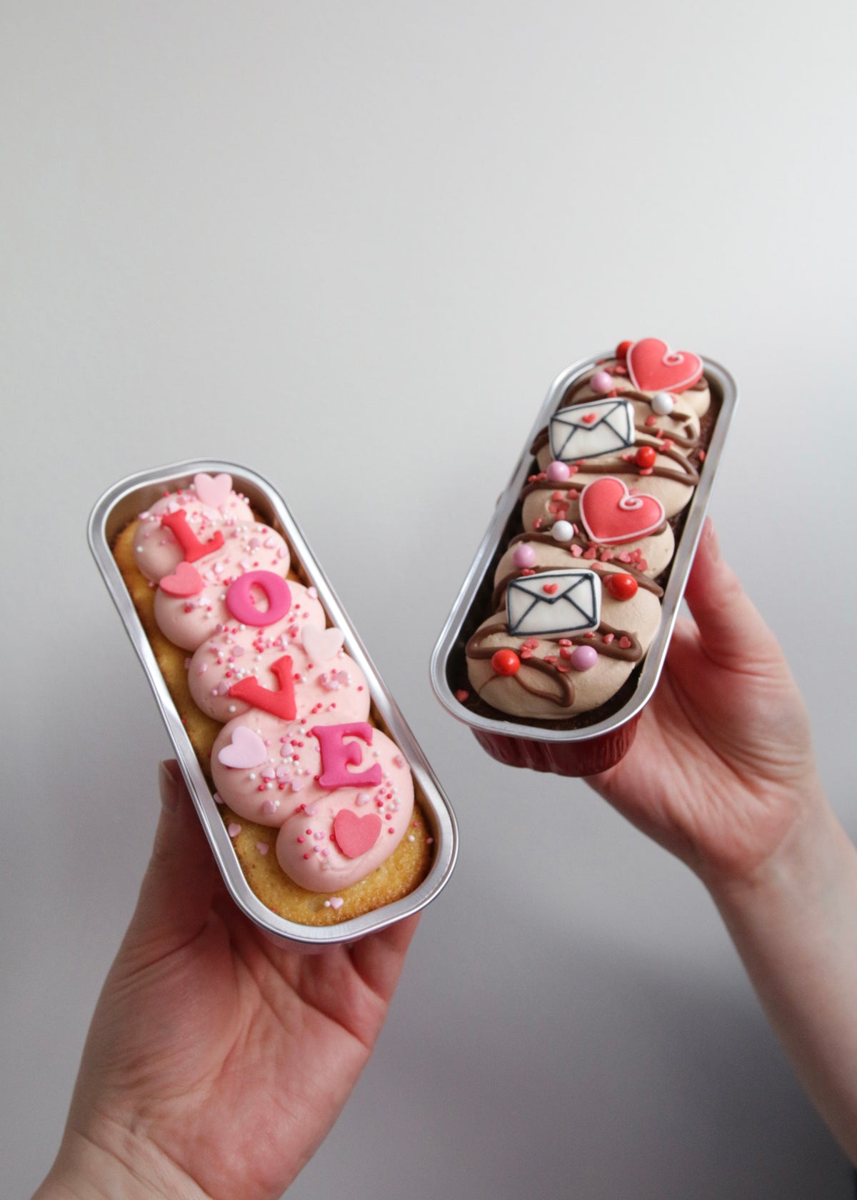 Holding Set of Valentine's Little Loaf Cakes