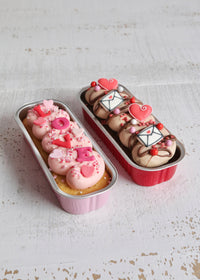 Set of Two Valentine's Little Loaf Cakes on Table