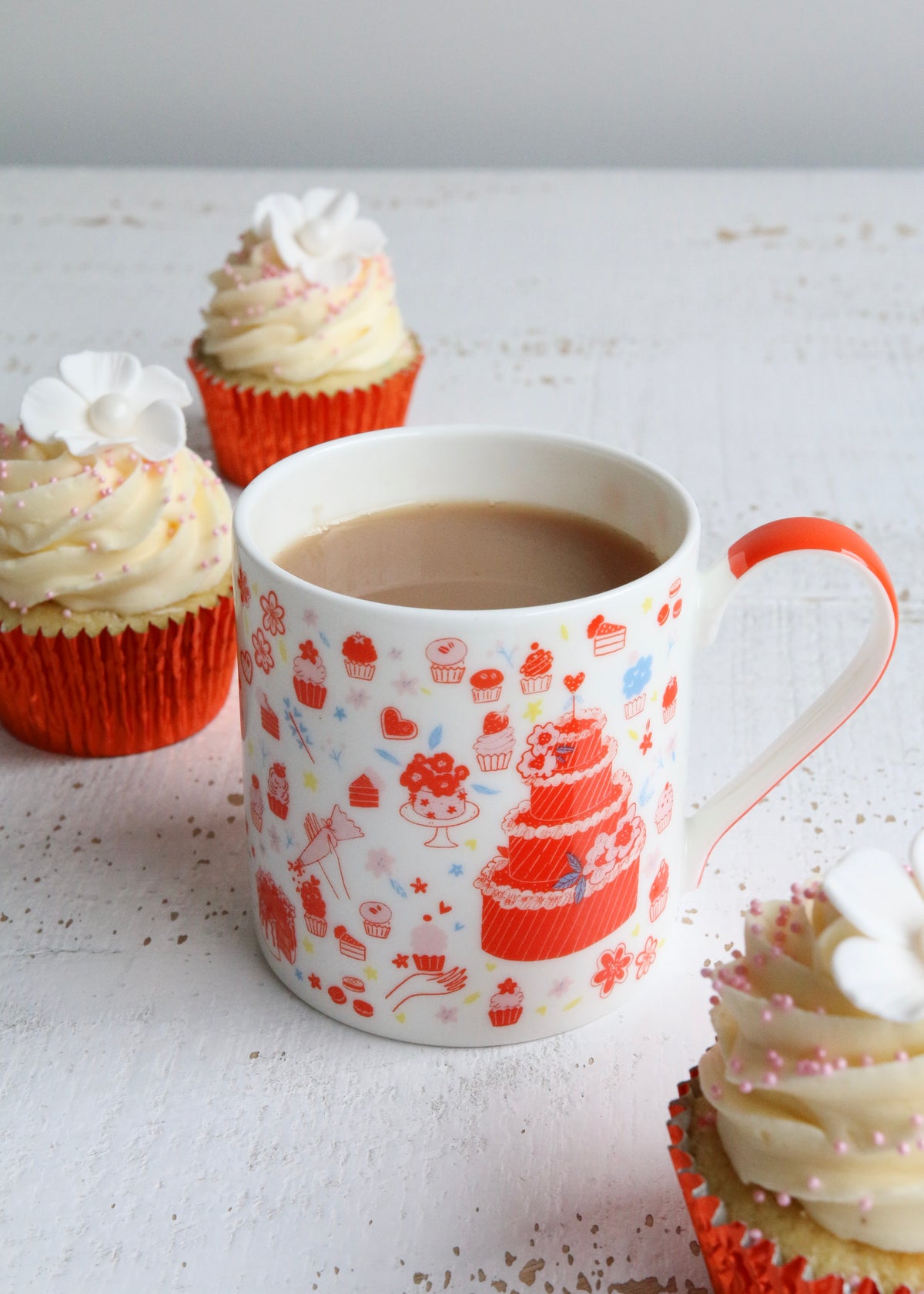 Illustrated Mug Featuring Cake & Cupcakes with Orange Handle