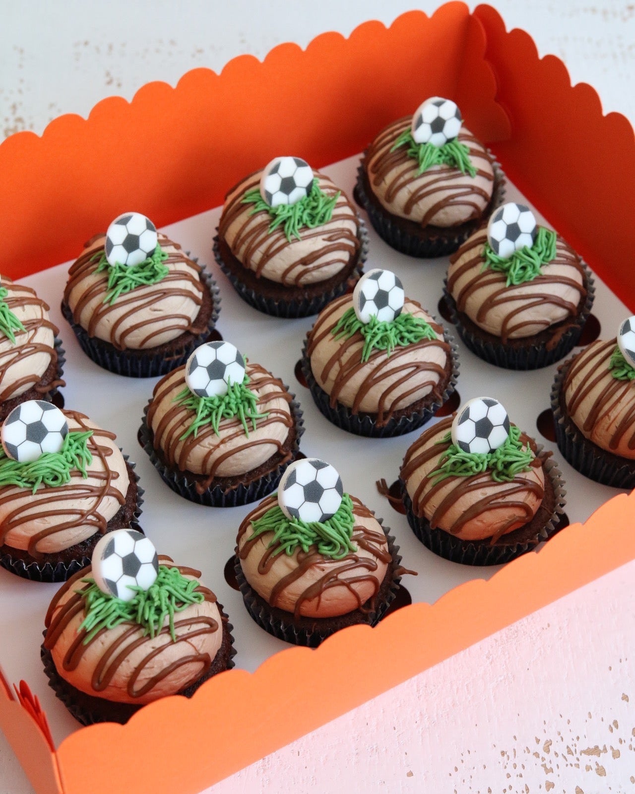 Box of Chocolate Football Cupcakes