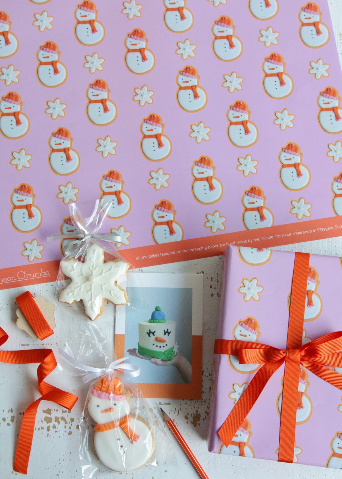 Christmas Snowman Biscuit Wrapping Paper Flat Lay with Card and Biscuits