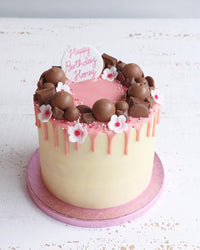 Pink Vanilla Drip Cake with Chocolates