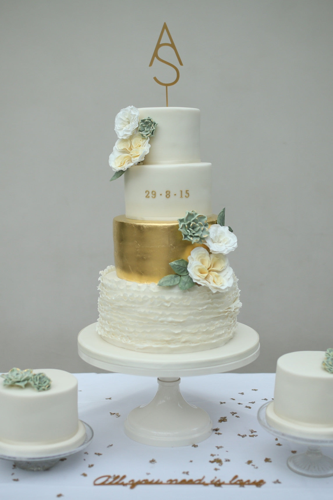 Wedding Cake with Succulents, Gold Leaf and Ruffles